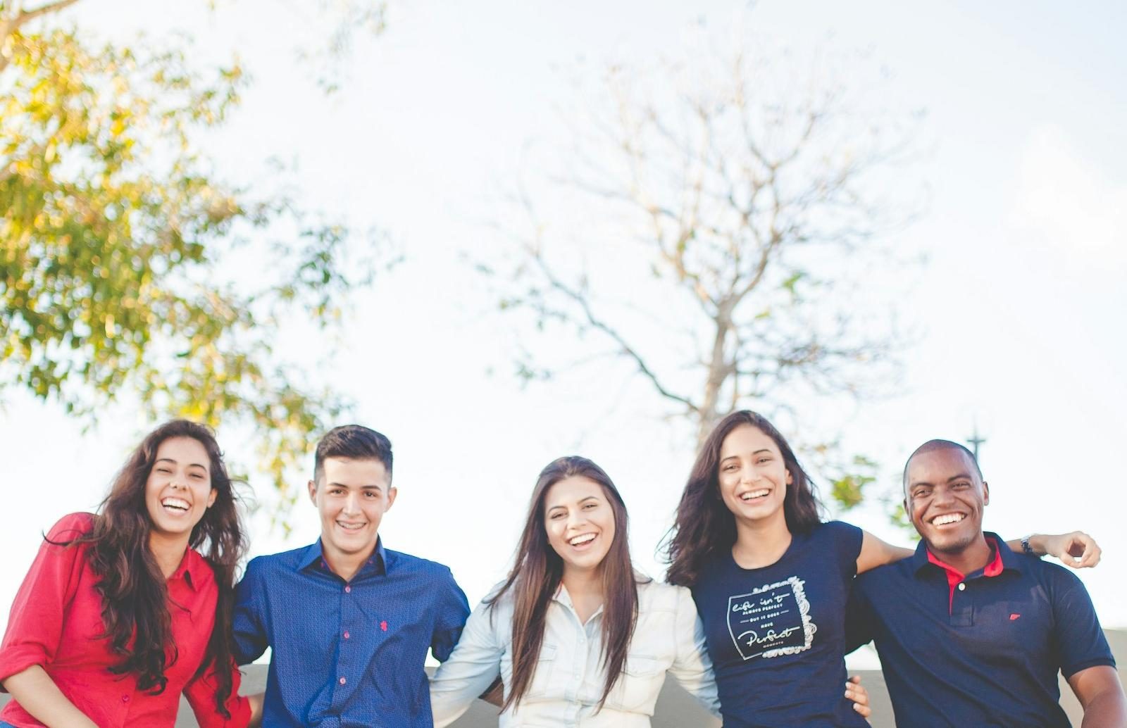 Happy university students together on campus